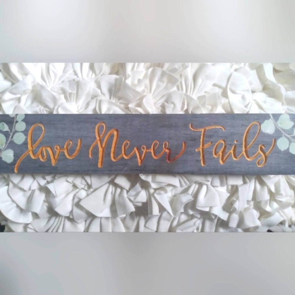 Love never Fails wooden sign